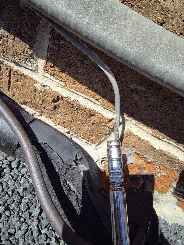 Responded to warranty call for evaporator coil noise complaint. Accessed air handler unit and inspected internal components including evaporator coil assembly, refrigerant lines, blower compartment, and electrical connections. Examined copper refrigerant tubing with insulation, flexible ductwork connections, and heat exchanger assembly for signs of loose mounting hardware, debris contact, or mechanical interference. Verified all mounting brackets and fasteners were properly secured. Inspected outdoor refrigerant line set connections and insulation integrity. All components found to be properly installed and secured with no visible defects or interference points that would cause operational noise. System marked as operational and meeting manufacturer specifications.