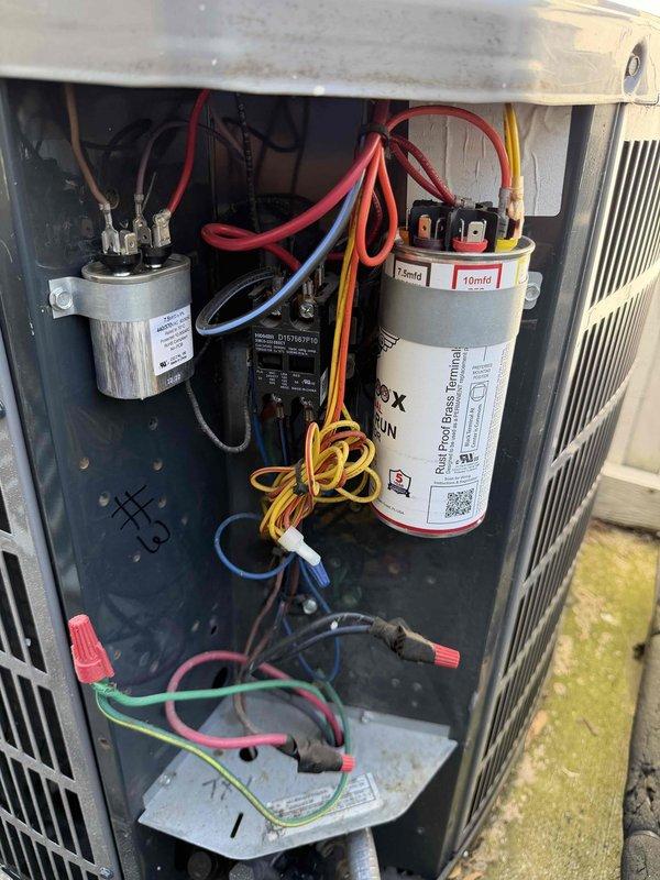 Completed comprehensive cooling maintenance agreement service on three air conditioning systems with gas furnace included. Performed thorough inspection of Lennox furnace installation in basement utility area, checking all PVC venting connections, drainage lines, and electrical components. Accessed and inspected capacitor compartments on multiple AC units, verifying proper operation of run capacitors (including 10mfd blower capacitor), contactors, and all electrical connections. All wiring terminals were found secure with appropriate color-coded connections intact. Documented equipment conditions through photographic records for maintenance history. All systems operational and performing within manufacturer specifications upon completion of preventive maintenance inspection.