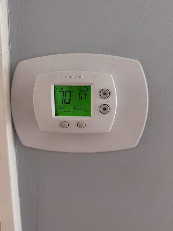 Completed preventative maintenance agreement service on dual condenser HVAC system. Changed 16x25x1 air filter, inspected thermostat operation confirming proper temperature control and system cycling, and documented existing corrosion on condensate drain line connections requiring future attention.