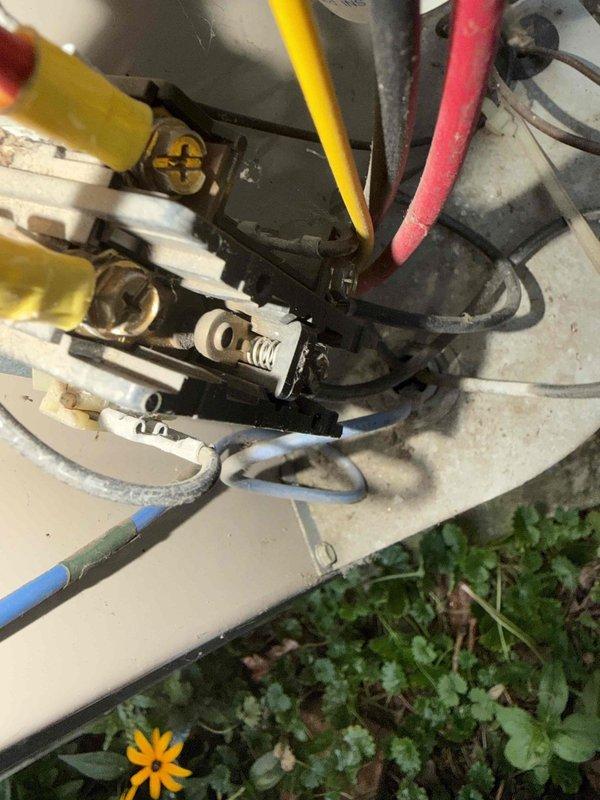 Responded to service call for AC unit not cooling and making noise upon startup. Inspected outdoor condensing unit and found electrical connections at contactor showing signs of wear and outdoor exposure. Examined capacitor, contactor assembly, and associated wiring within electrical compartment. All wire connections were secured and terminals cleaned. Verified proper voltage and amperage at contactor. Capacitor tested within acceptable range. Unit cycled successfully with normal operation restored and noise eliminated upon startup.