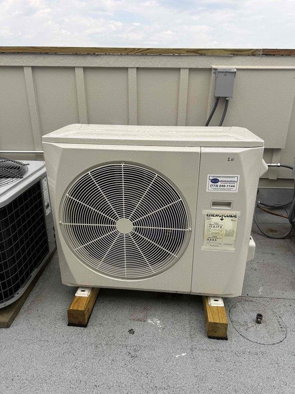Returned to site to relocate rooftop air conditioning condenser unit approximately 6 inches to the left to provide proper clearance from gas line and water valve. Repositioned electrical disconnect box to wall behind unit for improved accessibility and code compliance. Unit now properly positioned on wooden support blocks with adequate clearance from all utilities and service access maintained.