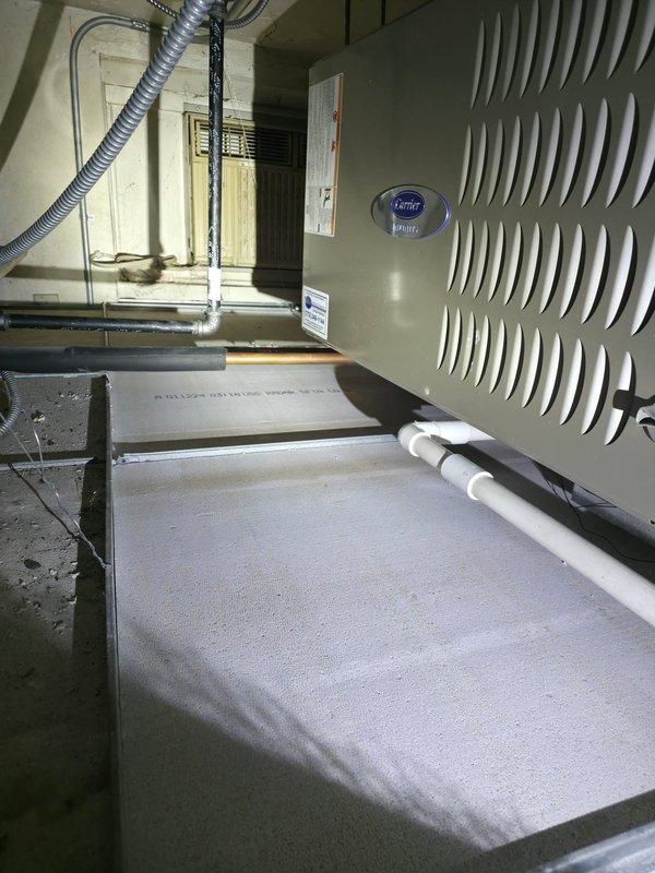 Responded to service call for ceiling tile repair in back office area near rear door. Upon arrival, accessed mechanical room to inspect HVAC system and verify proper operation of Carrier air handler unit. Confirmed clean air filter installation and proper equipment function. Proceeded to back office location where ceiling tile damage was reported. Set up ladder and safety equipment, then removed damaged acoustic ceiling tile from drop ceiling grid system near ventilation grille. Installed replacement ceiling tile, ensuring proper fit within existing grid framework and alignment with adjacent tiles and HVAC components. Verified smoke detector remained undisturbed and all ceiling penetrations were properly sealed. Documented conditions with photographs before completing work. Site left clean with all damaged materials removed and ceiling system restored to proper appearance and function.