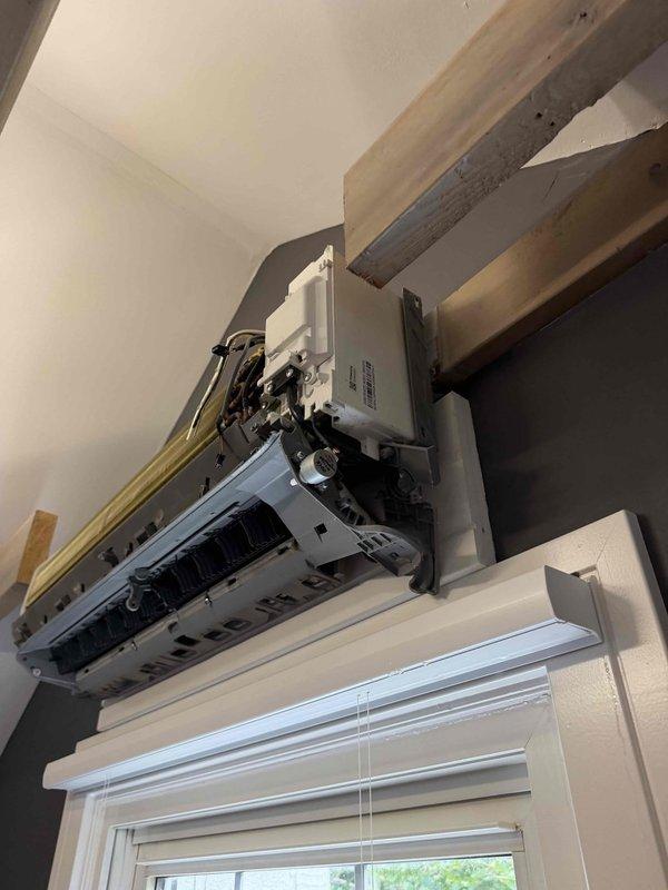 Responded to no cooling complaint on bedroom mini-split system. Upon inspection, discovered refrigerant leak in evaporator coil assembly. Removed indoor unit cover to access internal components and confirmed leak location through visual inspection and system pressure analysis. Documented equipment condition showing compromised coil integrity requiring refrigerant recovery and system repair or component replacement to restore proper cooling operation.