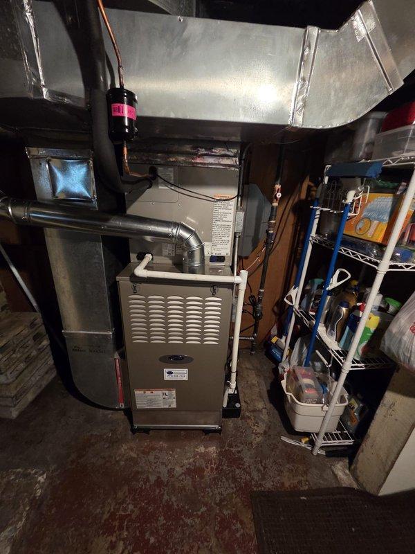 Completed full HVAC system replacement in residential basement mechanical room, including installation of new furnace unit with proper ductwork connections and plenum integration. Installed condensate pump, fan-powered humidifier, surge protector, and Ecobee thermostat to provide complete climate control functionality. All equipment properly mounted, vented with PVC piping, and connected to existing ductwork system with metal transitions, ensuring efficient airflow and system operation.