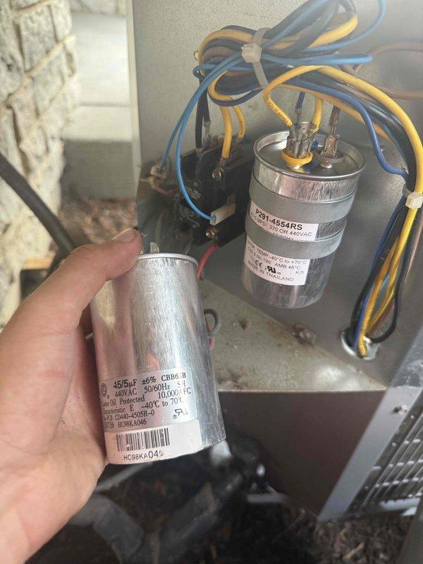 Returned to complete repair by replacing failed dual-run capacitor (45/5 MFD, 370/440 VAC) and installing new condenser fan wheel assembly. Removed old damaged fan blades and mounted replacement blade assembly to restore proper airflow and system operation.