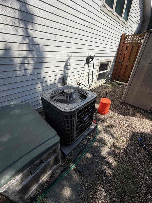 Completed HVAC maintenance agreement inspection on residential air conditioning system. Performed routine inspection of outdoor condenser unit, checked refrigerant lines, and documented equipment condition with photographs showing normal wear and outdoor weathering but no critical issues requiring immediate attention.