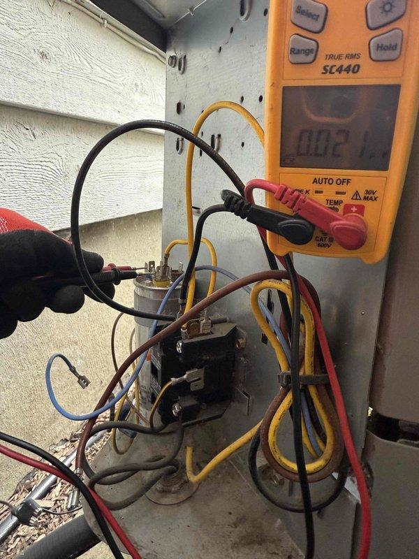 Responded to no cooling complaint on residential split system air conditioning unit. Upon arrival, confirmed system was running but delivering warm air to conditioned space. Performed visual inspection of outdoor condensing unit and verified compressor was not operating while condenser fan motor was running normally.

Conducted electrical diagnostics at contactor assembly to determine root cause of compressor failure. Using digital multimeter, measured voltage at contactor terminals and confirmed proper line voltage present at unit. Testing revealed contactor was not energizing to close contacts and supply power to compressor. Verified 24-volt control circuit was functioning correctly, indicating failed contactor was preventing compressor from receiving power.

Replaced defective contactor with new component rated for system specifications. Verified all electrical connections were secure and properly terminated. Cycled system through complete operation and confirmed compressor engaged 