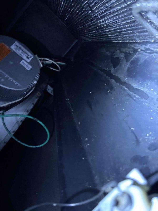Responded to no cooling complaint caused by wet switch safety shutoff. Upon inspection, found excessive condensate accumulation in air handler drain pan triggering the float switch. Cleared condensate drain line obstruction, verified proper drainage, tested system operation, and confirmed unit cycling normally with wet switch reset.