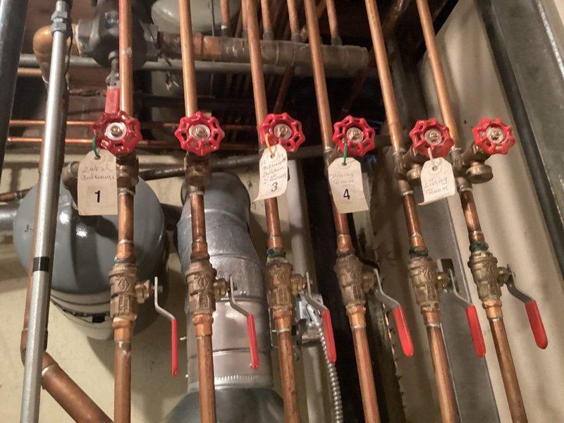 Performed routine maintenance on water boiler system including inspection of six-zone copper manifold with ball valves and gate valves, all zones properly tagged and operational. Inspected expansion tank and associated plumbing connections, verified all components functioning within normal parameters with no leaks or deficiencies noted.