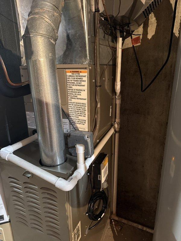 Successfully completed installation of new rear system air conditioning equipment. Replaced condenser unit positioned closest to garage and installed new evaporator coil on existing basement furnace. Verified thermostat programming and system operation upon completion.