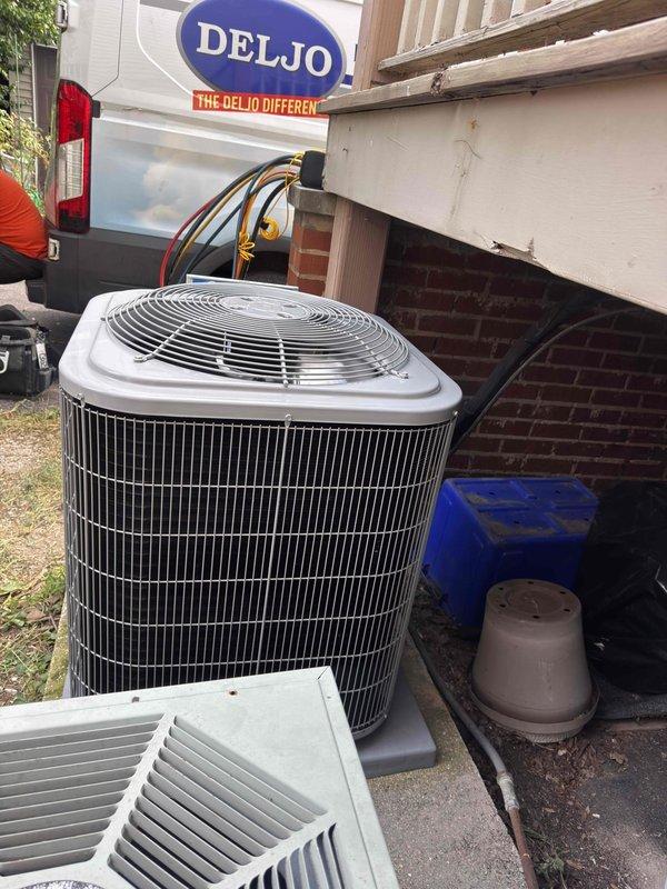 Completed full HVAC system replacement including furnace, condenser unit, evaporator coil, and programmable thermostat. New outdoor condenser unit installed on concrete pad with proper electrical connections and refrigerant lines routed through foundation. Digital thermostat installed and programmed to manufacturer specifications, displaying proper operation at 42 degrees setpoint during system testing.