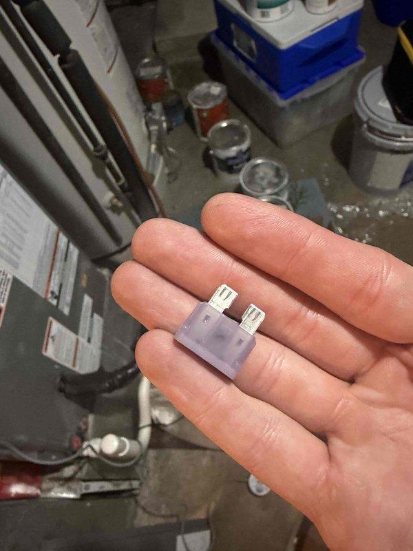 Responded to no cooling call on air conditioning system less than 10 years old. Upon inspection, discovered blown fuse in low voltage control circuit. Replaced defective fuse with proper replacement, restored power to system, and verified unit returned to normal cooling operation.