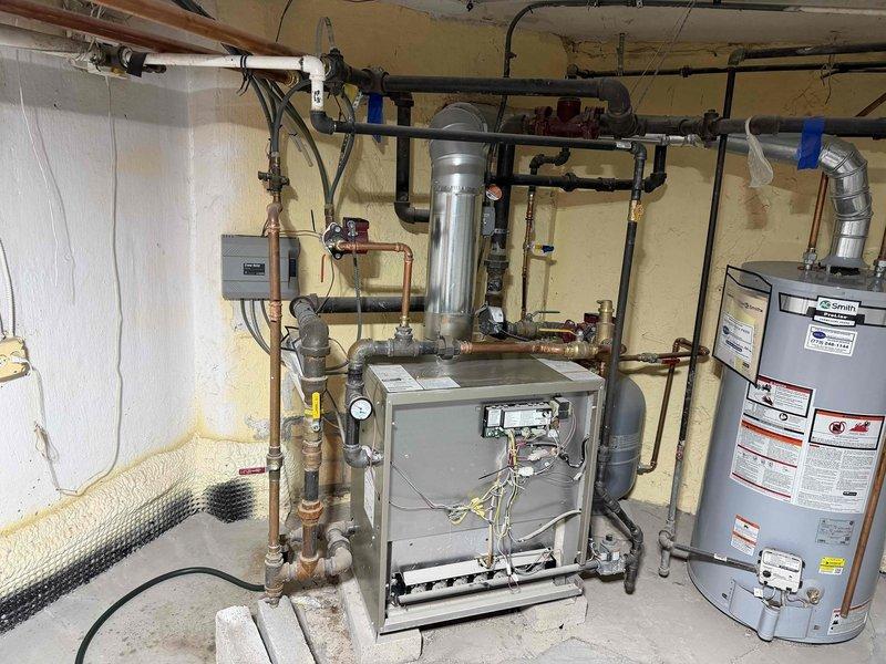 Responded to no-heat call on recently installed boiler system. Upon arrival, inspected boiler unit, associated piping network, and control systems. Diagnosed ignition failure, performed troubleshooting procedures on burner assembly and control board, verified gas supply and pressure readings, and restored unit to proper operation with successful ignition and heating cycle confirmed.