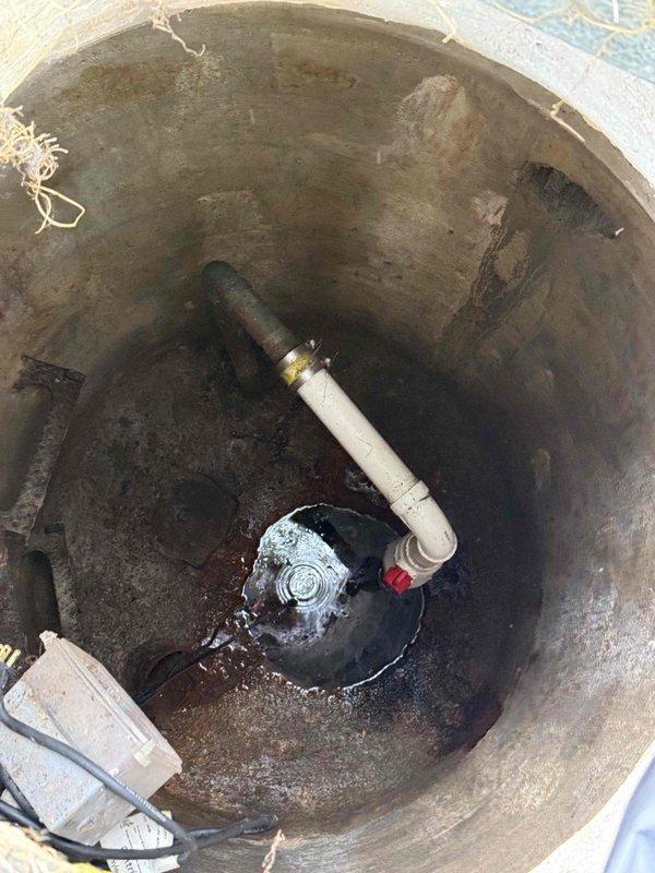 Returned to property to complete installation of new sump pump, ejector pump, and battery backup system in basement utility area. Removed existing failed pumps from concrete sump pit and ejector basin, which showed significant age-related deterioration and water staining. Installed replacement submersible pumps with appropriate discharge piping connections using PVC fittings and brass components. Configured battery backup system to ensure continued operation during power outages. Tested all pump operations, float switches, and discharge flow to verify proper functionality. System is now operational and providing reliable water removal and sewage ejection capabilities.