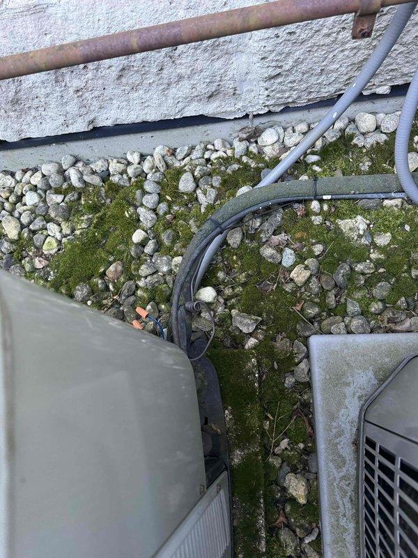 Provided comprehensive estimate for complete replacement of two full HVAC systems serving multi-zone residential property. Existing equipment has exceeded 15-year service life and requires full system changeout. Site assessment documented current configuration of four outdoor condenser units positioned along exterior wall with gravel pad installation, existing electrical disconnects, and refrigerant line routing between mechanical units showing signs of age and weathering.