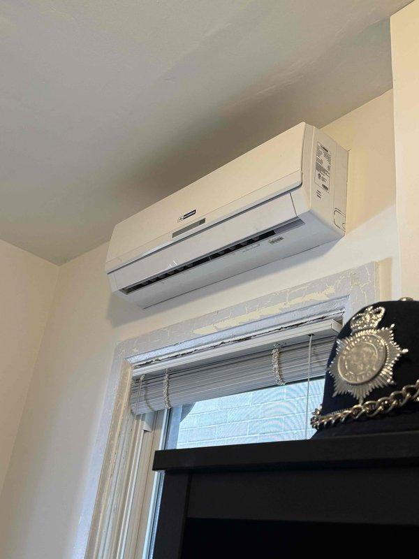 Conducted estimate for mini split system replacement consisting of 5 indoor heads approximately 4-5 years old. Documented existing equipment condition showing significant water damage to ceiling near one indoor unit with visible staining, discoloration, and material deterioration indicating moisture infiltration. Photographed split-type air conditioner specifications and multiple wall-mounted ductless units throughout property. Assessed system viability and provided repair versus replacement options for aging multi-zone mini split installation.