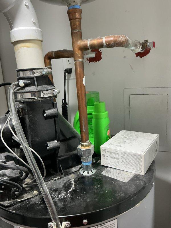 Responded to callback for persistent leak issue on Unit 12. Upon arrival, confirmed water accumulation in drain pan beneath air handler, same condition as previous visit. Inspected condensate drain system, PVC drain lines, and associated plumbing connections. Documented equipment condition with photos showing copper piping with visible oxidation and thermostat in OFF position reading 77°F. Further investigation required to identify source of continued water infiltration and resolve drainage problem.
