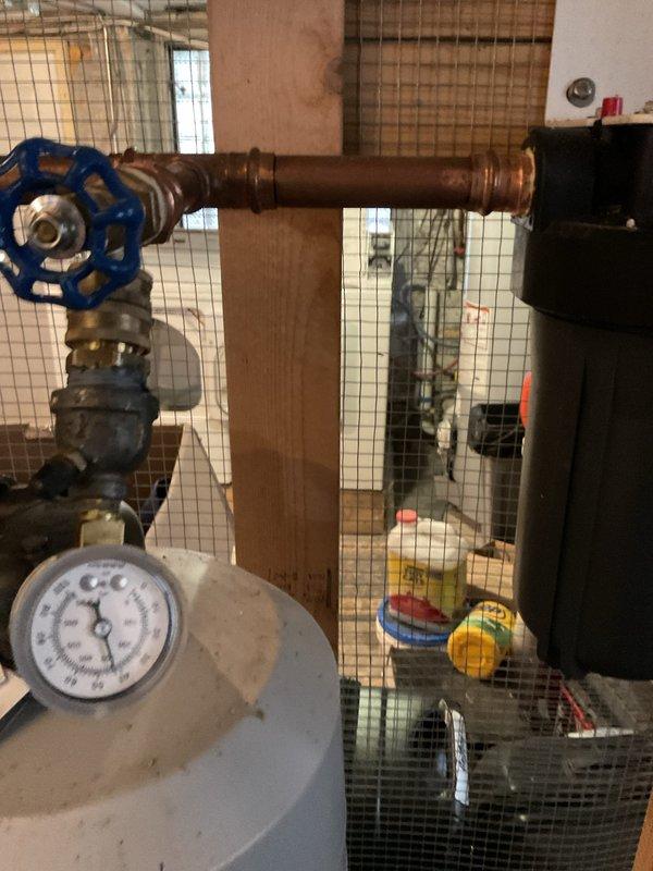 Responded to callback for water pressure concerns following previous installation of whole-home water filtration system post filter and battery backup sump pump. Inspected pressure gauge readings on filtration system and verified proper operation of all valves and connections. Confirmed system pressure within normal parameters and determined no issues related to previous service work.