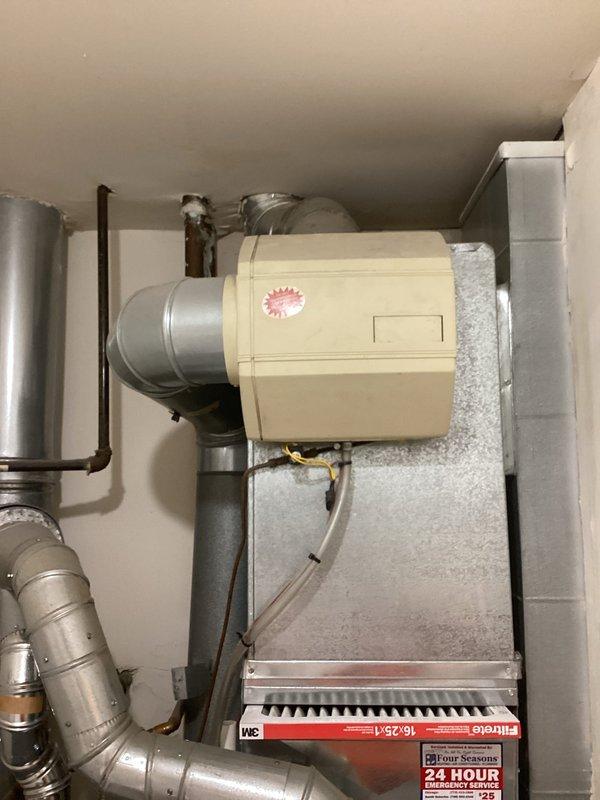 Wired existing humidifier unit to Ecobee thermostat control system, establishing proper electrical connection between the equipment mounted on the same wall. Verified humidifier operation and confirmed integration with thermostat for automated humidity control functionality.