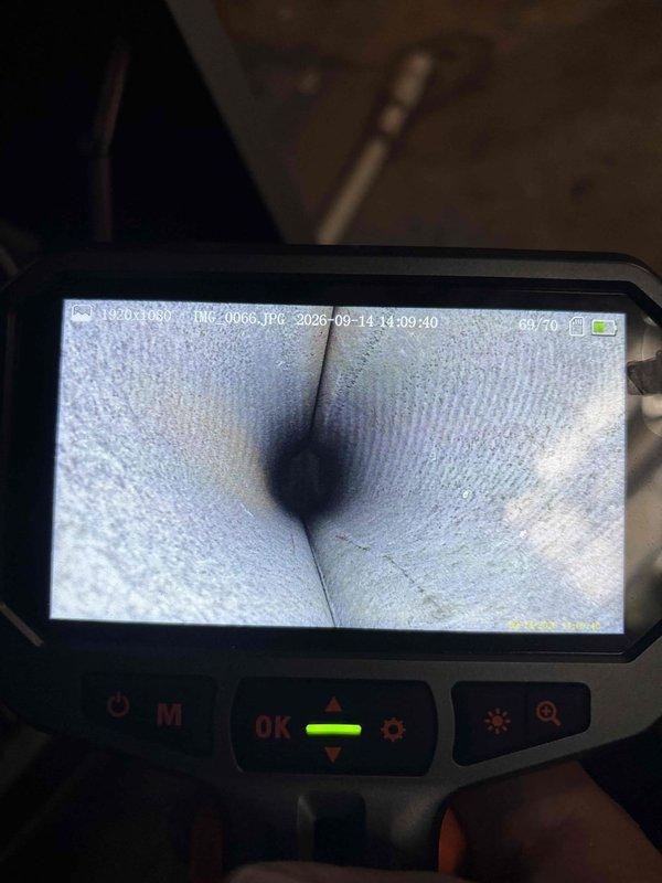 Performed comprehensive HVAC maintenance agreement inspection on dual furnace system. Conducted internal ductwork examination using borescope camera to assess condition of duct liner material and verify proper seam integrity at junction points. Inspected furnace components including gas valve connections, electrical wiring harness, and internal access compartments. All system components found to be in proper working condition with connections secure and wiring properly routed.
