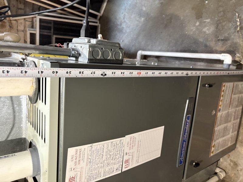 Completed full HVAC system replacement for first floor air conditioning unit. Installed new furnace with proper venting configuration including PVC intake and exhaust pipes, connected refrigerant lines, and verified electrical connections in basement utility space. All equipment mounted on appropriate platform with manufacturer specifications confirmed and system operational upon completion.