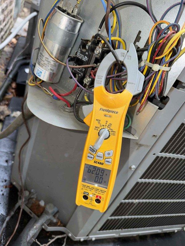 Completed spring cooling inspection on dual condenser system as part of recurring maintenance agreement. Performed comprehensive electrical diagnostics using digital multimeter to verify capacitor functionality, contactor operation, and proper voltage levels across all electrical components. Inspected condenser coils, verified proper wiring connections, and confirmed disconnect box operation. All equipment found in functional condition with normal operational wear. System operating within manufacturer specifications.