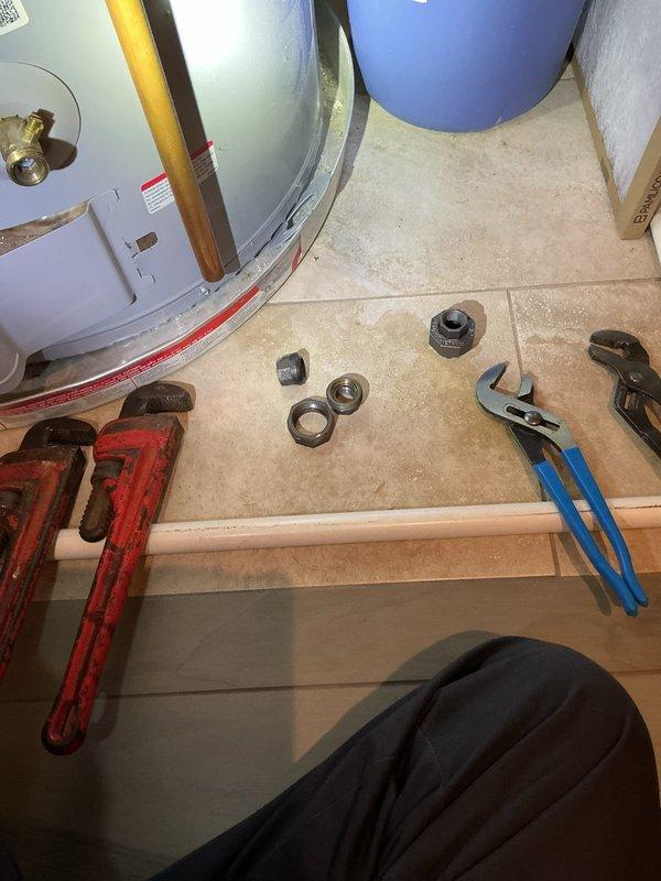 Responded to callback for reported gas odor in utility closet following maintenance performed four weeks prior. Upon arrival, conducted thorough inspection of water heater and associated gas piping connections. Performed leak detection testing on all gas line fittings, unions, and connections using approved methods. Disassembled and inspected multiple pipe fittings and connections that showed signs of potential compromise. Tightened all gas line connections to manufacturer specifications and replaced suspect fittings as necessary. Verified proper installation of water heater components and confirmed all piping, including copper supply lines and PVC venting, met code requirements. Conducted final leak test on entire gas system to ensure no detectable gas presence. Cleared area of gas odor and confirmed safe operation of water heater before completing callback.