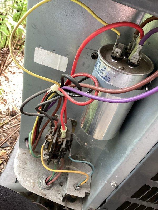 Responded to no cooling complaint where system was struggling to maintain temperature during hot weather. Upon inspection, found blower wheel heavily contaminated with dust and debris accumulation, significantly restricting airflow throughout the system. Inspected outdoor unit electrical components including capacitor and contactor connections, which appeared functional. Documented conditions with photos for property owner review per instructions to discuss necessary repairs before proceeding with cleaning or additional work.