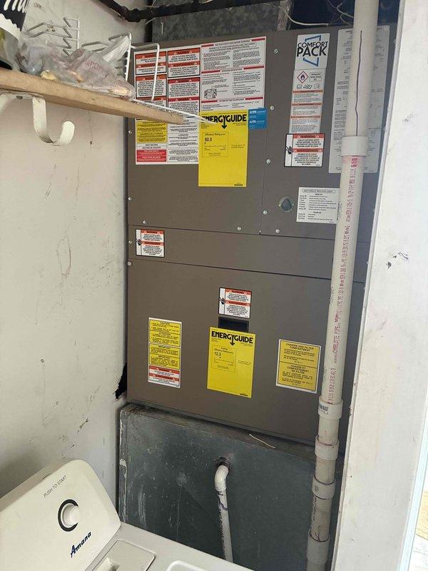 # HVAC Air Handler Replacement

Successfully replaced existing air handler unit with new cabinet-style system in residential utility closet. Installation included proper mounting, electrical connections, condensate drain line configuration using PVC piping, and verification of all safety labels and energy efficiency documentation. Unit was tested for proper operation and airflow upon completion.