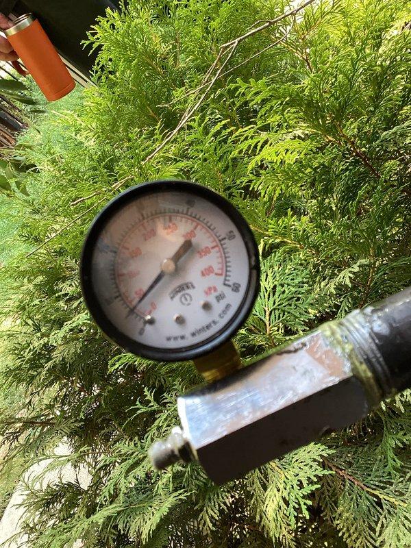 Performed comprehensive gas pressure test on multi-meter natural gas system serving the property. Main gas supply remains shut off pending resolution of system integrity concerns. Testing conducted on manifold configuration serving five individual gas meters mounted on exterior wall, utilizing calibrated pressure gauge to verify system holds proper pressure specifications and identifying any potential leaks or pressure drops that would prevent safe restoration of gas service.