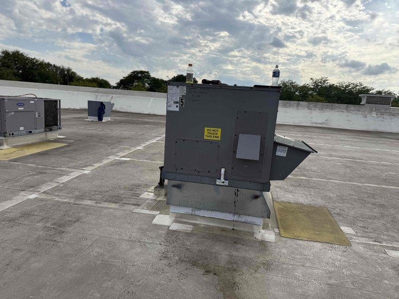 Conducted site walk-through to document and inventory rooftop HVAC equipment for commercial facility. Located and photographed multiple rooftop units including packaged systems, recorded unit identification numbers, filter specifications (16x16x2), and equipment locations for treatment area (#6927) and veterinary facility. Documentation completed to prepare equipment summary prior to scheduling comprehensive maintenance service.
