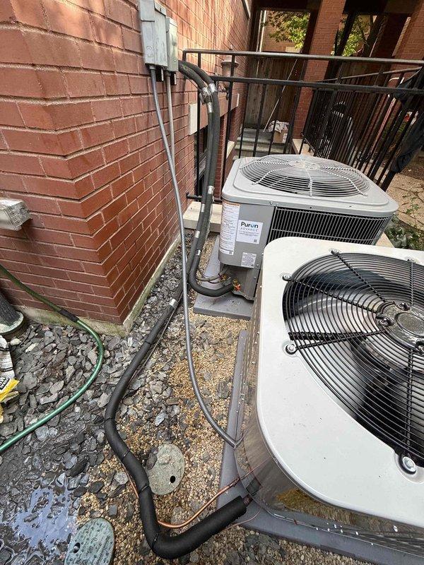 Completed full HVAC system replacement for second floor including furnace, air handler, and outdoor condensing unit. Installed new air conditioning condenser and evaporator coil for first floor system. Both outdoor units positioned on concrete pad with proper refrigerant line sets, electrical disconnects, and protective guards. Installed two whole-system surge protectors, humidifier integration on second floor unit, and smart thermostat for zone control. All refrigerant lines properly insulated and secured to building structure with appropriate mounting brackets. Systems commissioned, refrigerant charges verified using digital diagnostic equipment, and temperature differentials confirmed within manufacturer specifications. Installation completed by four-person crew over approximately one and a half days.