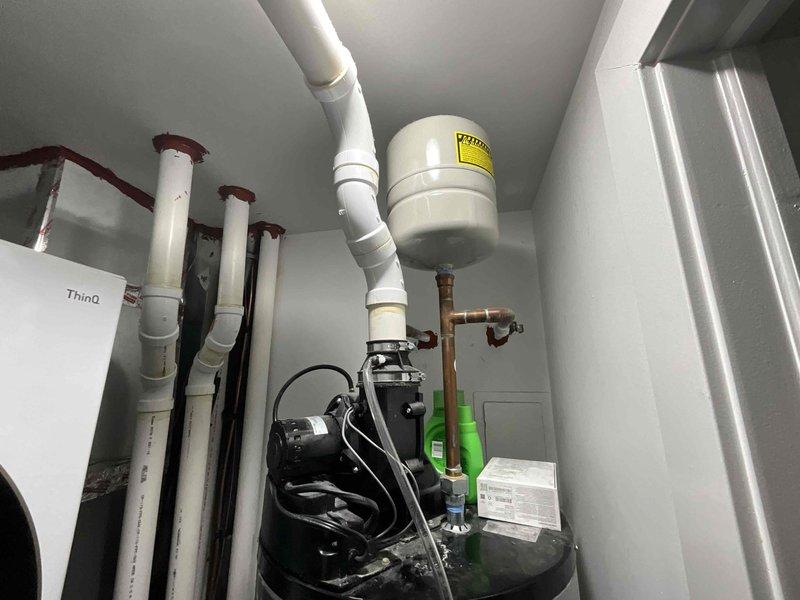 Completed replacement of existing tank-style water heater with new Navien tankless unit in utility closet. Previous tank configuration restricted access to HVAC equipment located behind the water heater, requiring equipment upgrade to resolve accessibility issues for future maintenance and service requirements.