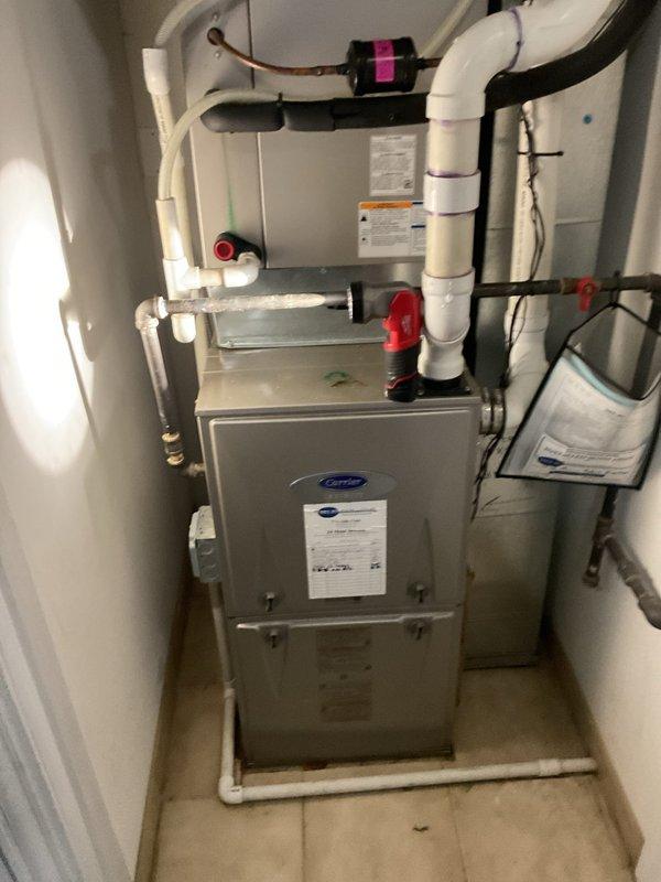 Performed gas leak pressure test on HVAC system. Installed pressure gauge on gas line to monitor system integrity and verify no leaks present in the Carrier furnace installation. Testing confirmed proper pressure readings and system safety, with all connections and valves functioning as specified.