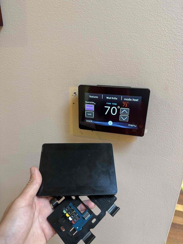 Responded to no-cooling complaint following previous thermostat installation. Replaced Infinity thermostat and verified system operation. Performed temperature differential measurements at supply register, confirming 18.9°F reading. Tested system controls and confirmed proper heating mode functionality with 70°F ambient temperature and 73°F setpoint displaying correctly on new thermostat interface.