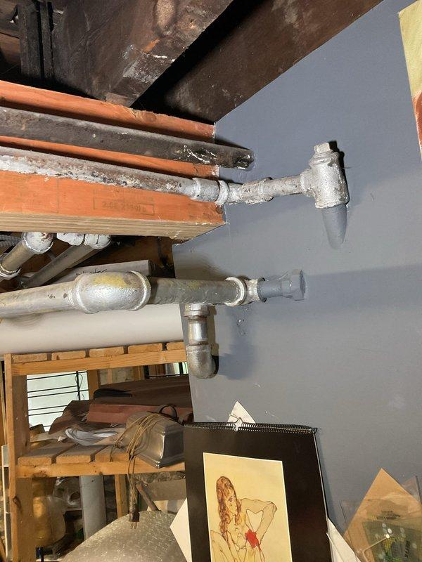 Responded to service call for reported gas leak in basement. Upon arrival, conducted thorough inspection of gas piping system and mechanical equipment area. Located minor gas leak at threaded pipe connection near water heater installation. Performed leak detection testing using approved methods to confirm location and severity of leak. Shut down gas supply to affected area and verified system isolation. Disassembled leaking joint, inspected threads for damage and proper engagement. Applied new pipe thread sealant and reassembled connection to manufacturer specifications. Restored gas supply and conducted comprehensive leak check of repair and surrounding connections using electronic gas detector and soap solution. Verified all connections were secure with no detectable leaks. Tested system operation and confirmed proper function of all equipment. Documented conditions with photographs showing basement mechanical room, exposed piping, and equipment layout for service records.