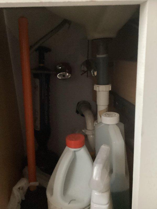Completed comprehensive whole home plumbing inspection with primary focus on kitchen drain system and basement floor drain. Inspected under-sink plumbing configuration including copper supply lines, PVC drain assembly with P-trap, and all associated fittings and connections for proper operation and potential leaks. Examined A.O. Smith ProLine Commercial water heater installation, verifying proper connections, venting through aluminum ductwork, and condition of copper supply piping and brass fittings. All accessible plumbing components, drain lines, and fixtures were visually assessed for code compliance, functionality, and signs of deterioration or needed maintenance.