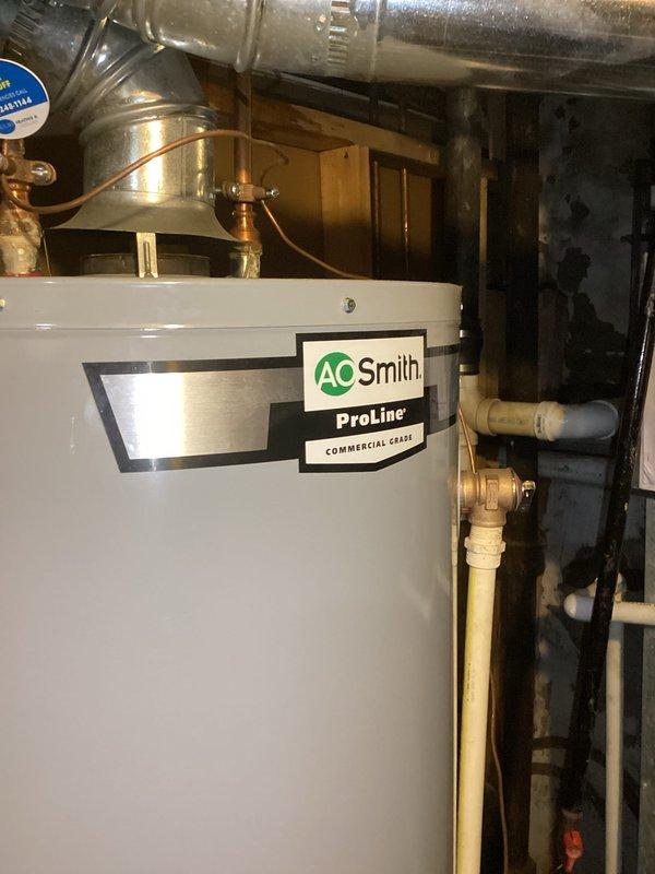 Completed comprehensive whole home plumbing inspection with primary focus on kitchen drain system and basement floor drain. Inspected under-sink plumbing configuration including copper supply lines, PVC drain assembly with P-trap, and all associated fittings and connections for proper operation and potential leaks. Examined A.O. Smith ProLine Commercial water heater installation, verifying proper connections, venting through aluminum ductwork, and condition of copper supply piping and brass fittings. All accessible plumbing components, drain lines, and fixtures were visually assessed for code compliance, functionality, and signs of deterioration or needed maintenance.