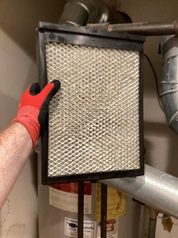 Completed cooling and heating system maintenance agreement inspection. Replaced 16x25x1 air filter on air conditioning unit and installed #35 filter along with 16x25x1 filter on furnace and humidifier system. Documented existing corrosion on metal ductwork components during inspection, noting deteriorated surfaces with rust buildup around penetrations that may require future attention.