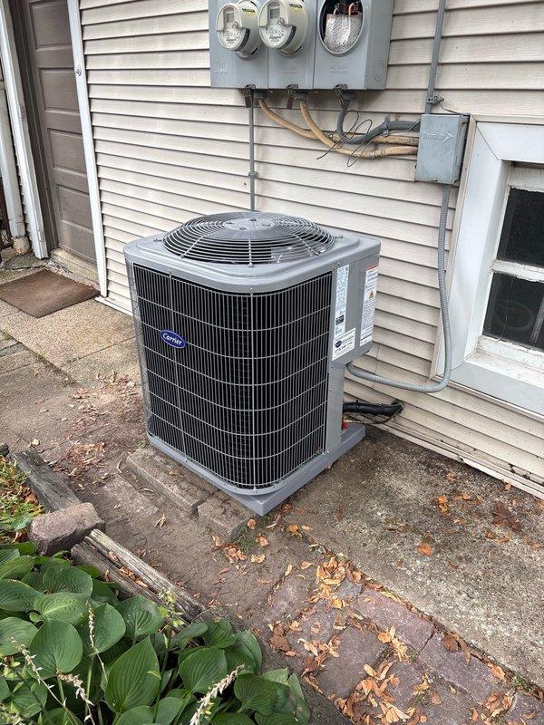 Completed full HVAC system replacement including furnace, condenser unit, and evaporator coil. Installed new Carrier outdoor condensing unit on existing concrete pad with proper electrical disconnect and refrigerant line connections. Replaced indoor furnace and evaporator coil assembly with all necessary gas piping, venting, and condensate drain connections. Verified all electrical connections, tested system operation, and confirmed proper heating and cooling functionality upon completion.