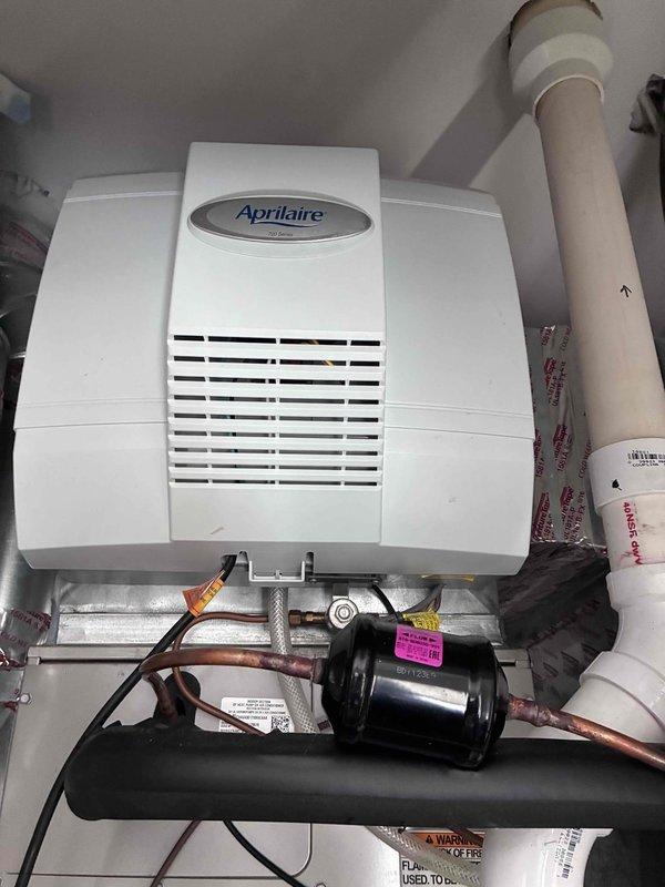 Completed comprehensive maintenance on two furnaces, two Aprilaire humidifiers, one boiler, and one water heater as part of scheduled agreement service. Replaced dynamic filters with 20x25x1 and 16x25x1 sizes, and installed #35 humidifier pad in both units. All equipment inspected, cleaned, and verified operational with photo documentation of humidifier installations completed.