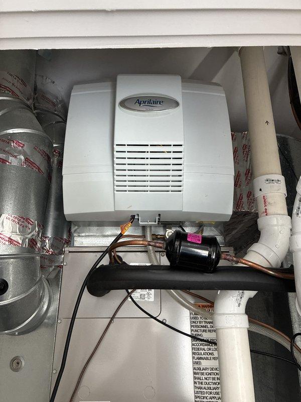 Completed comprehensive maintenance on two furnaces, two Aprilaire humidifiers, one boiler, and one water heater as part of scheduled agreement service. Replaced dynamic filters with 20x25x1 and 16x25x1 sizes, and installed #35 humidifier pad in both units. All equipment inspected, cleaned, and verified operational with photo documentation of humidifier installations completed.