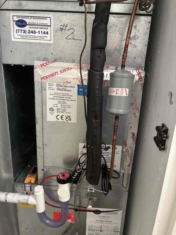 Returned to address warranty concern on recently installed evaporator coil. Verified system operation and measured supply air temperature at 53.2°F, confirming proper cooling performance. Inspected indoor air handler cabinet, checked all refrigerant line connections, electrical components, and condensate drainage system with safety switch. All components functioning within manufacturer specifications and installation completed to code.