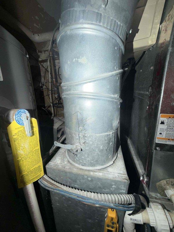 Completed comprehensive maintenance on furnace and humidifier system under service agreement. Replaced humidifier pad and installed #10 and 16x25x1 filter, performed system inspection with temperature readings confirming proper operation at 77.3°F, and documented equipment condition with photos showing ductwork, plumbing connections, and HVAC components in good working order.