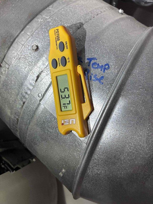 Responded to no cooling complaint on 10+ year old Carrier system. Upon inspection, measured supply air temperature at 53.7°F at duct, indicating insufficient cooling capacity. Unit was running but laboring to maintain temperature setpoint. Performed diagnostic evaluation of system performance and documented conditions with thermal measurements to determine cause of reduced cooling efficiency.