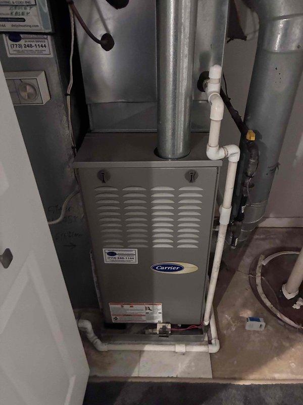 Responded to no cooling complaint on 10+ year old Carrier system. Upon inspection, measured supply air temperature at 53.7°F at duct, indicating insufficient cooling capacity. Unit was running but laboring to maintain temperature setpoint. Performed diagnostic evaluation of system performance and documented conditions with thermal measurements to determine cause of reduced cooling efficiency.