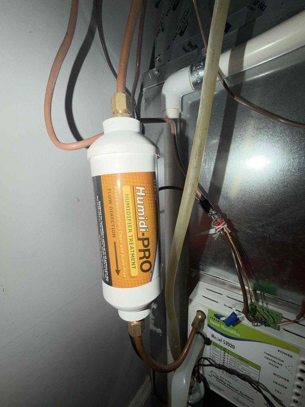 Performed maintenance on Unico COTW system including acid cleaning of Humidi-PRO steam humidifier and replacement of air handler filter. All equipment inspected and verified operational, with humidifier properly reconnected to system and functioning correctly upon completion.