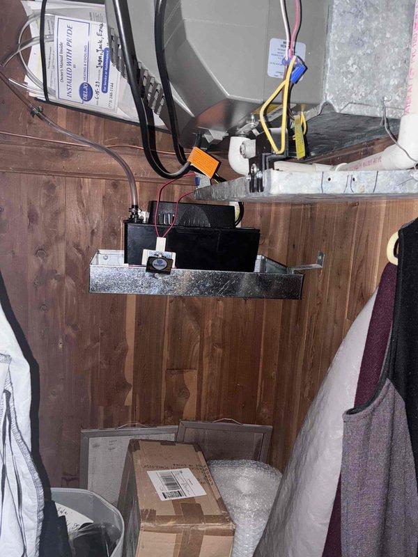 Replaced faulty safety pan beneath condensate pump unit in mechanical room. Removed old pan, installed new pan on galvanized metal platform, and verified proper drainage alignment with existing pump assembly to prevent water damage from potential overflow conditions.