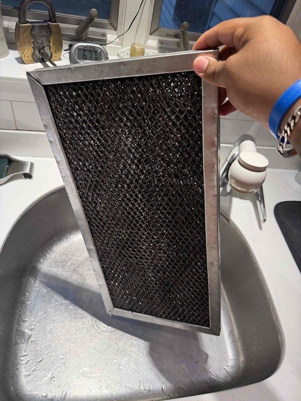 Completed comprehensive maintenance agreement service on air conditioning system, air handler, and humidifier unit #35. Performed thorough inspection and cleaning of heavily soiled evaporator coils which exhibited significant dust and debris accumulation across both coil sections. Took temperature and operational readings using digital instrumentation to verify system performance. Cleaned and inspected dirty mesh filter element removed from system. Service excluded media filter and electronic air cleaner per agreement specifications.