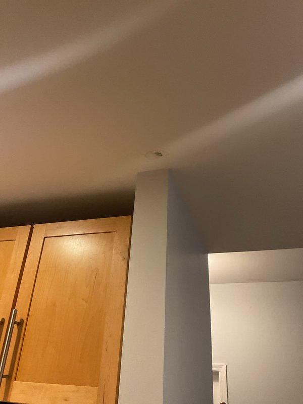 Conducted a comprehensive two-hour leak search investigation in a residential bathroom and adjacent kitchen area. Performed thorough visual inspection of all plumbing fixtures, including vessel sink, toilet, and cabinet areas, to identify potential water intrusion sources. Documented findings with photographic evidence showing cabinet interiors, wall conditions, and bathroom fixtures for repair assessment and future reference.